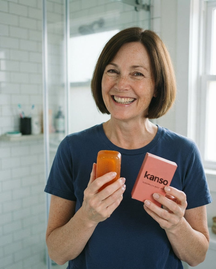 Sample review photo: woman holding the aki persimmon bar and box